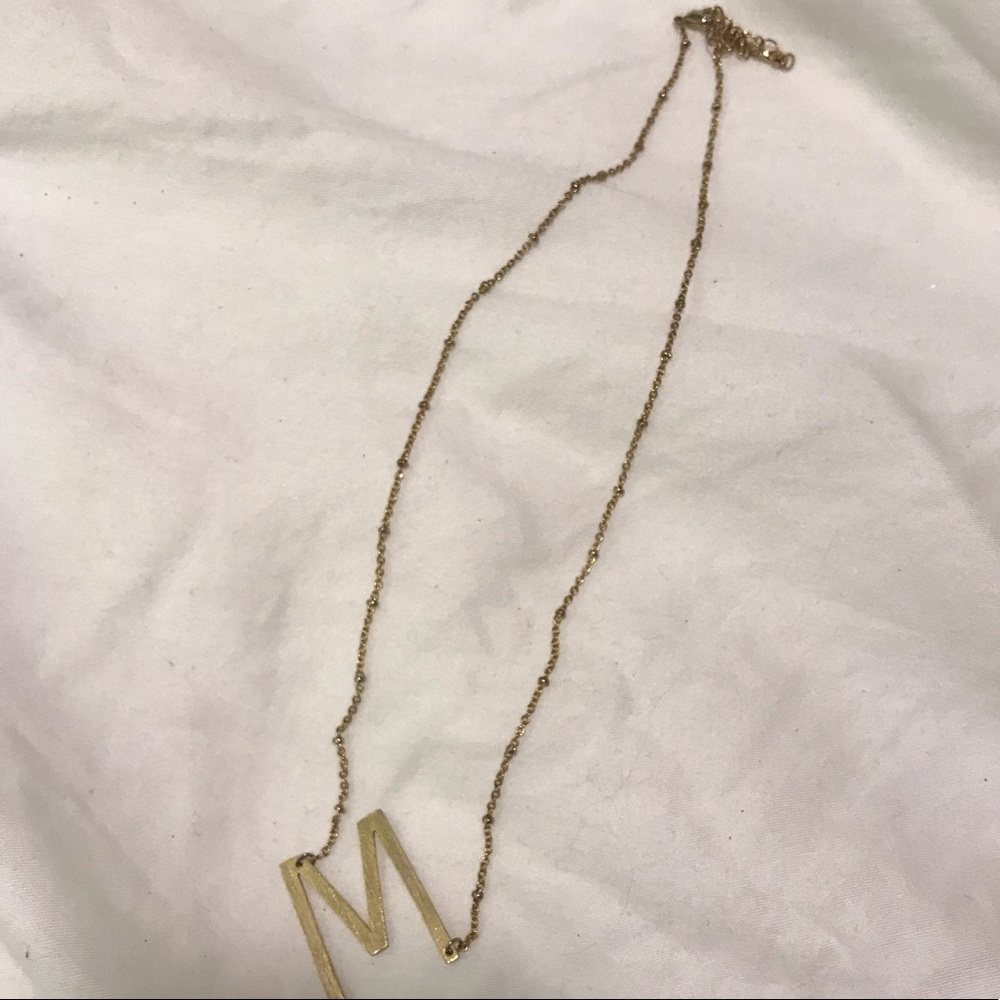 “M” gold necklace